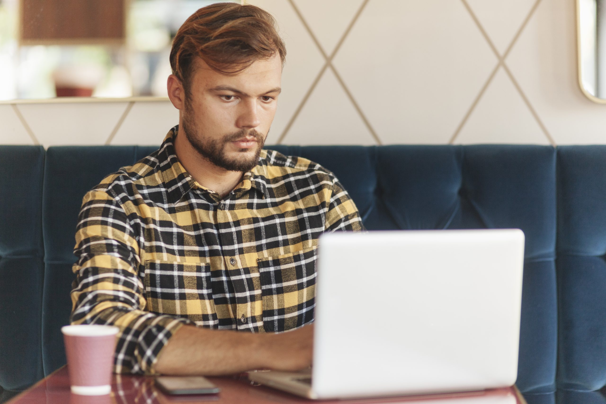 Man Using Laptop Coffee Shop